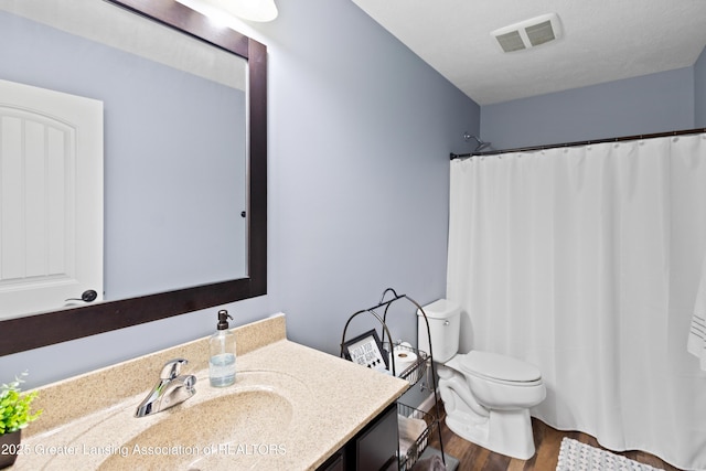 15925 Turnberry St, Lansing, MI 48906 - bathroom with vanity, wood finished floors, and a shower with shower curtain