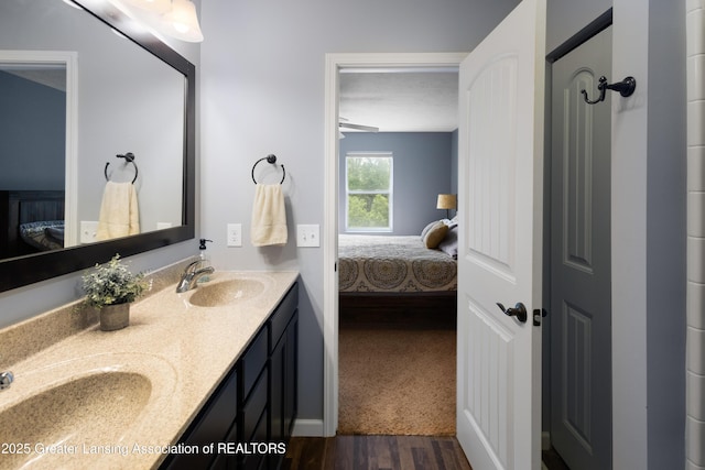 15925 Turnberry St, Lansing, MI 48906 - bathroom with ensuite bathroom, double vanity, and wood finished floors