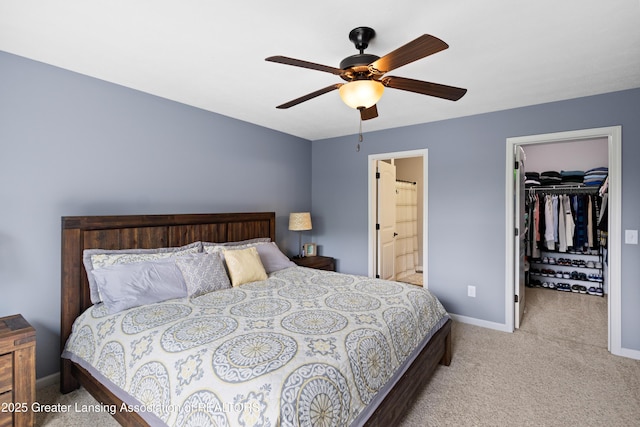 15925 Turnberry St, Lansing, MI 48906 - carpeted bedroom featuring a spacious closet, ensuite bathroom, ceiling fan, and a closet