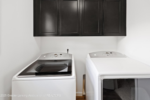 15925 Turnberry St, Lansing, MI 48906 - washroom featuring separate washer and dryer and cabinet space