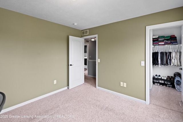 15925 Turnberry St, Lansing, MI 48906 - bedroom with carpet flooring, a walk in closet, and a closet
