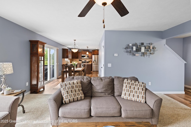15925 Turnberry St, Lansing, MI 48906 - living area with ceiling fan and light wood-style floors