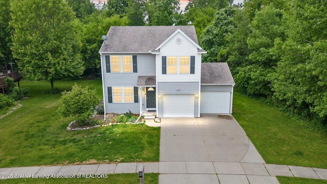 460 Blue Spruce Ln, Mason, MI 48854 - view of front of property featuring driveway, roof with shingles, a front lawn, and board and batten siding