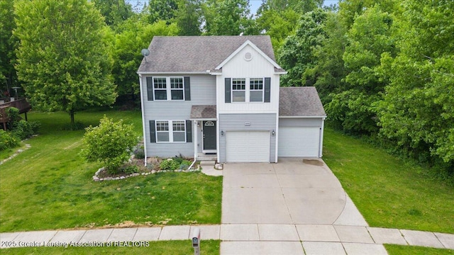 460 Blue Spruce Ln, Mason, MI 48854 - view of front facade with driveway, a front lawn, a shingled roof, and board and batten siding