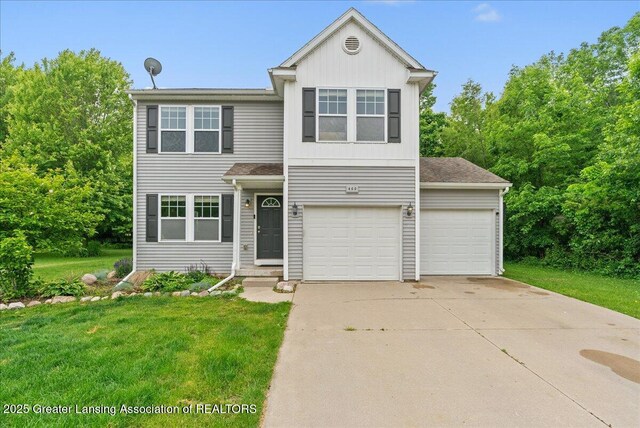460 Blue Spruce Ln, Mason, MI 48854 - traditional home featuring a front yard, driveway, and board and batten siding