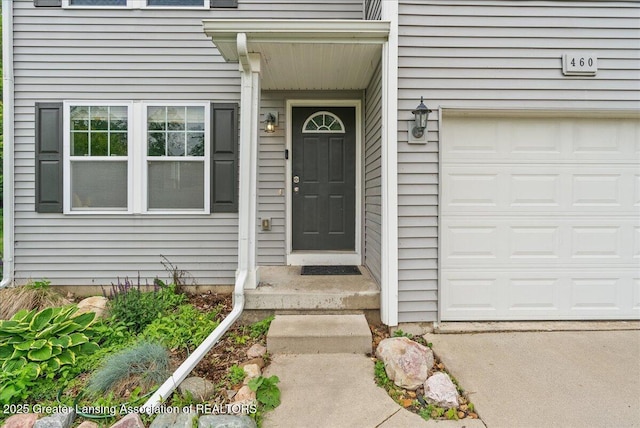 460 Blue Spruce Ln, Mason, MI 48854 - entrance to property with an attached garage