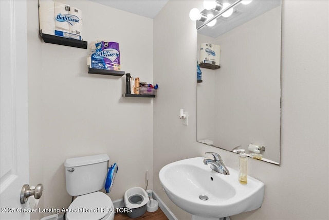460 Blue Spruce Ln, Mason, MI 48854 - half bathroom with a sink and toilet