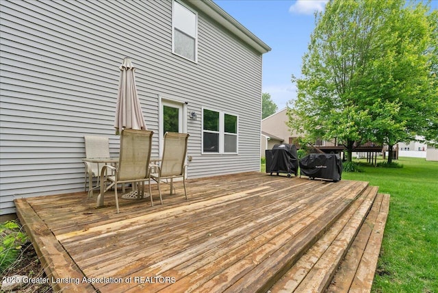 460 Blue Spruce Ln, Mason, MI 48854 - wooden deck with a grill and a yard