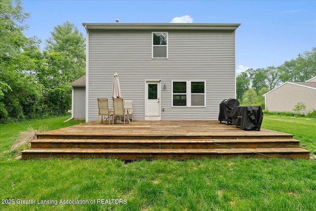 460 Blue Spruce Ln, Mason, MI 48854 - back of property featuring a yard and a wooden deck