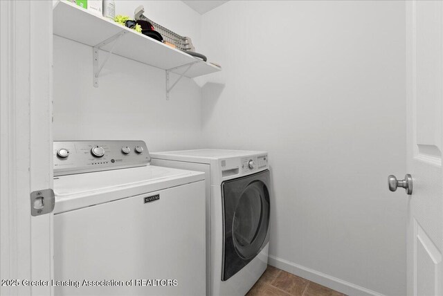 460 Blue Spruce Ln, Mason, MI 48854 - laundry room featuring washer and dryer and baseboards