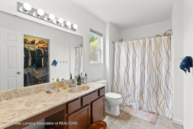 460 Blue Spruce Ln, Mason, MI 48854 - bathroom with vanity, curtained shower, and a spacious closet