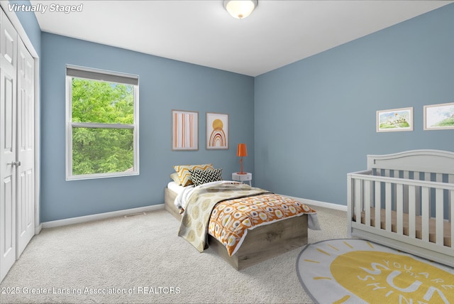 460 Blue Spruce Ln, Mason, MI 48854 - carpeted bedroom featuring baseboards and a closet