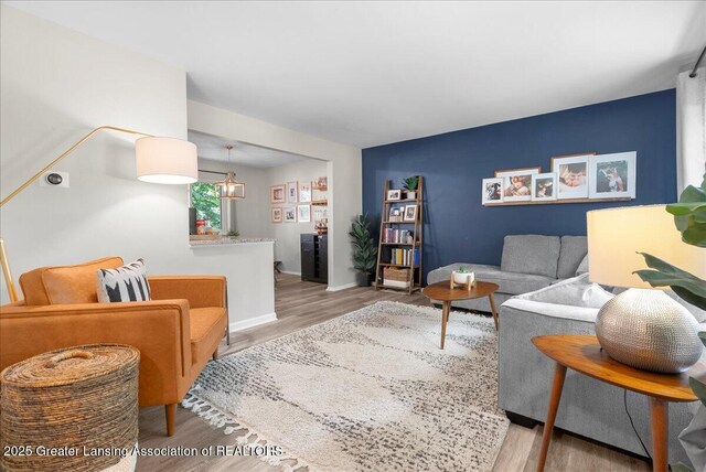 992 Touraine Ave, East Lansing, MI 48823 - living area featuring wood finished floors and baseboards
