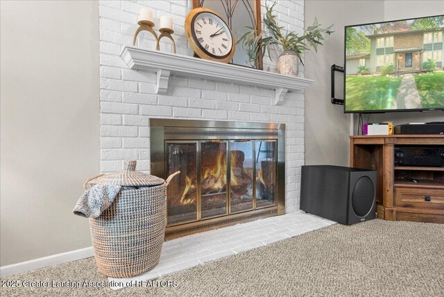 992 Touraine Ave, East Lansing, MI 48823 - detailed view of a brick fireplace, carpet floors, and baseboards