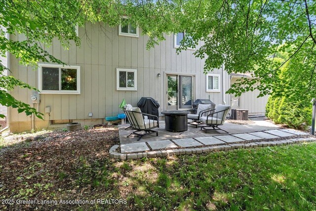 992 Touraine Ave, East Lansing, MI 48823 - rear view of property with a patio area and central air condition unit