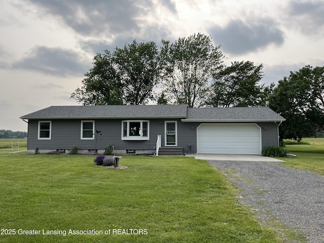 3220 Meridian Rd, Leslie, MI 49251 - single story home featuring a garage, driveway, and a front lawn
