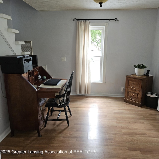 405 E Shaw St, Charlotte, MI 48813 - office area featuring light wood finished floors and baseboards