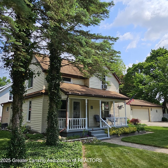 405 E Shaw St, Charlotte, MI 48813 - view of front facade with a porch, a garage, a front yard, roof with shingles, and cooling unit