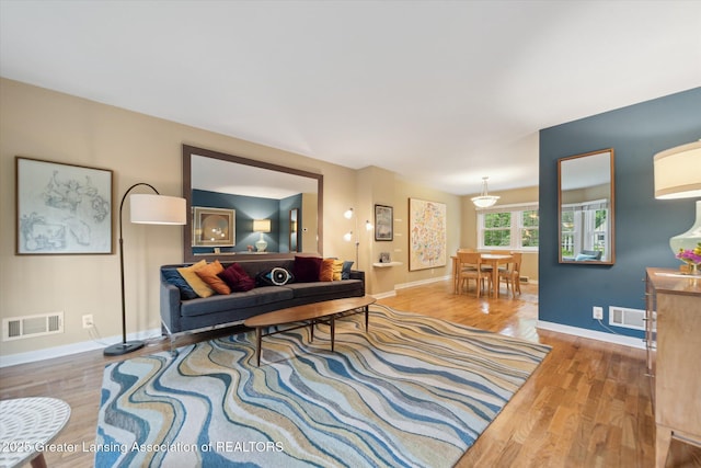 932 Sunset Ln, East Lansing, MI 48823 - living room featuring wood finished floors and baseboards