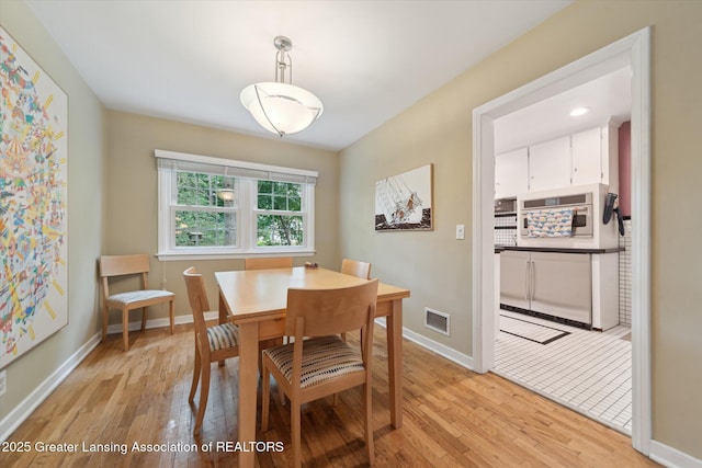 932 Sunset Ln, East Lansing, MI 48823 - dining room with light wood-type flooring