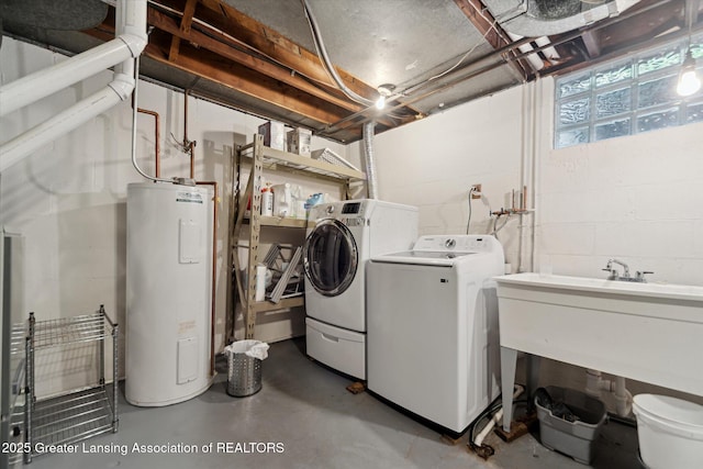 932 Sunset Ln, East Lansing, MI 48823 - washroom featuring water heater, washer and clothes dryer, and concrete block wall