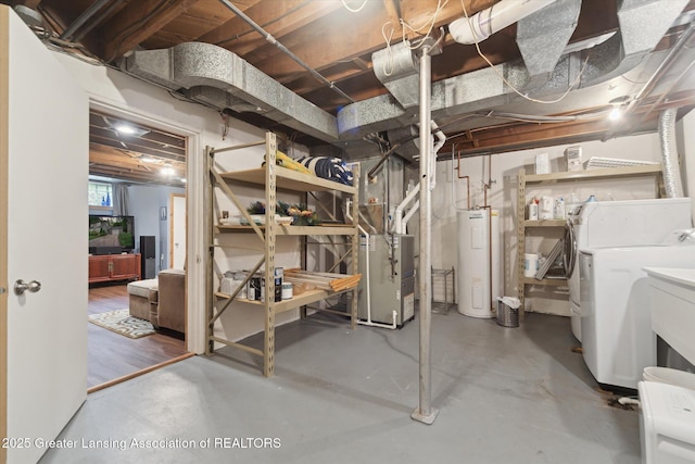 932 Sunset Ln, East Lansing, MI 48823 - below grade area with washer and dryer, water heater, and heating unit