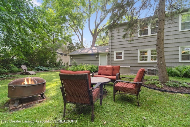 932 Sunset Ln, East Lansing, MI 48823 - view of green lawn with an outdoor living space with a fire pit