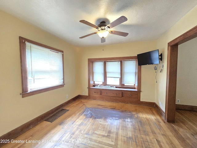 812 Westmoreland Ave, Lansing, MI 48915 - empty room featuring ceiling fan, baseboards, and wood finished floors