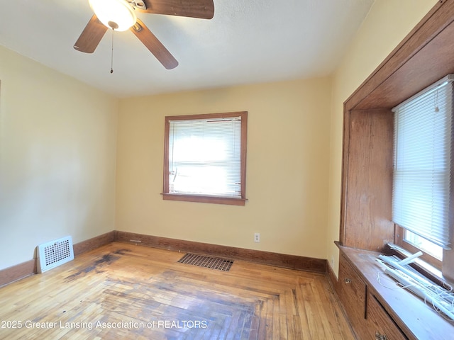 812 Westmoreland Ave, Lansing, MI 48915 - empty room featuring plenty of natural light, baseboards, and a ceiling fan