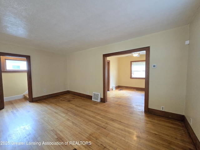 812 Westmoreland Ave, Lansing, MI 48915 - unfurnished room with light wood-style floors and baseboards