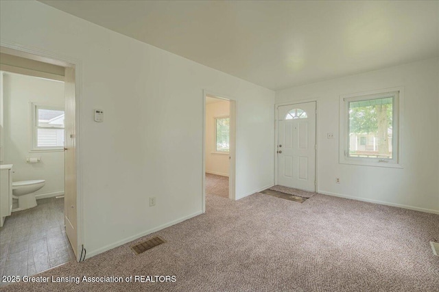 629 Emily Ave, Lansing, MI 48910 - entryway featuring light colored carpet and baseboards