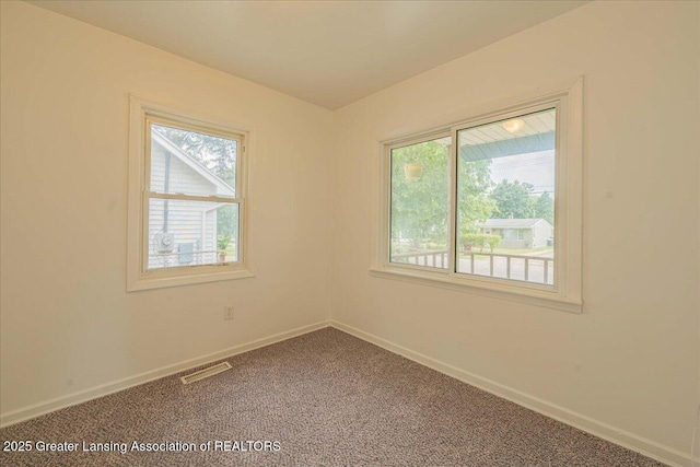 629 Emily Ave, Lansing, MI 48910 - spare room with carpet and baseboards