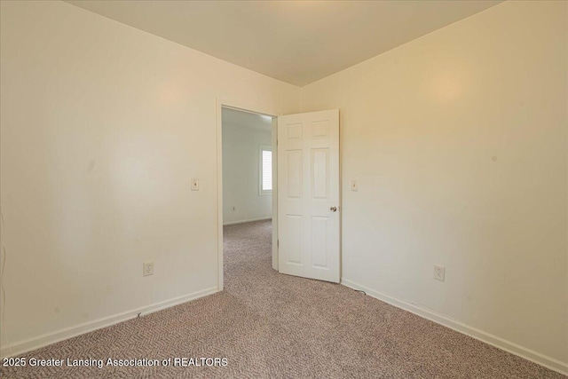 629 Emily Ave, Lansing, MI 48910 - unfurnished room with light colored carpet and baseboards