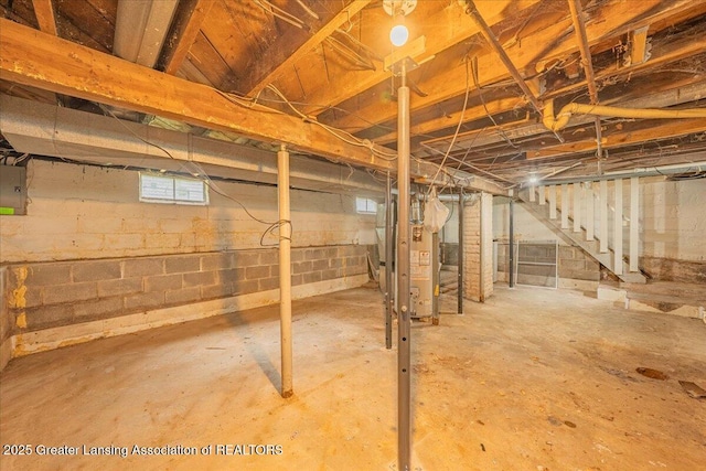 629 Emily Ave, Lansing, MI 48910 - basement with stairway, heating unit, and electric panel