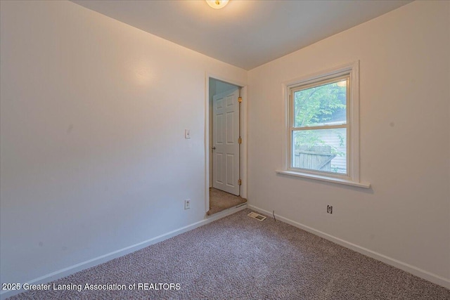 629 Emily Ave, Lansing, MI 48910 - carpeted empty room with baseboards