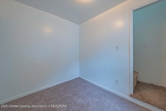 629 Emily Ave, Lansing, MI 48910 - empty room featuring carpet and baseboards