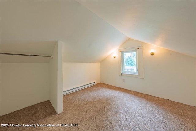 629 Emily Ave, Lansing, MI 48910 - additional living space with a baseboard radiator, carpet flooring, and lofted ceiling