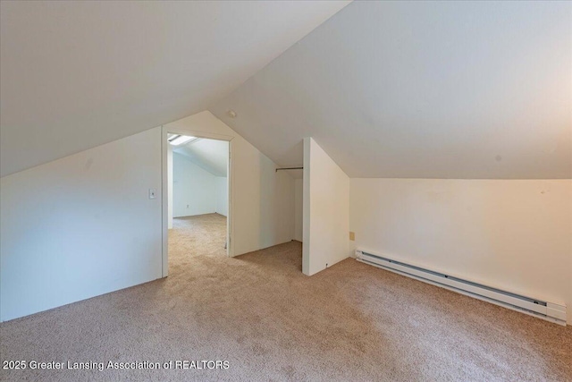 629 Emily Ave, Lansing, MI 48910 - bonus room featuring a baseboard radiator, light carpet, and lofted ceiling