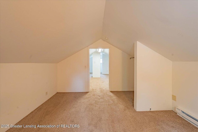 629 Emily Ave, Lansing, MI 48910 - bonus room with a baseboard heating unit, light colored carpet, and vaulted ceiling