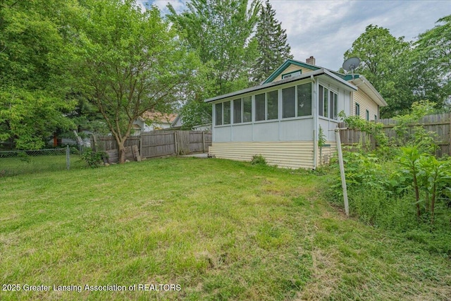 629 Emily Ave, Lansing, MI 48910 - view of yard featuring a sunroom