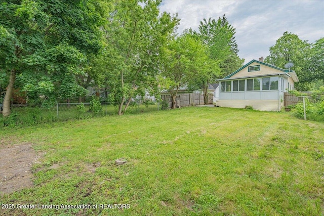629 Emily Ave, Lansing, MI 48910 - view of yard featuring a sunroom