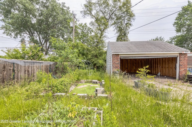 19326 Marlowe St, Detroit, MI 48235 - view of yard featuring a garage and an outbuilding
