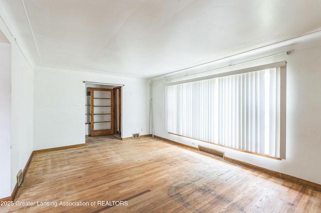 19326 Marlowe St, Detroit, MI 48235 - unfurnished room featuring plenty of natural light and wood finished floors
