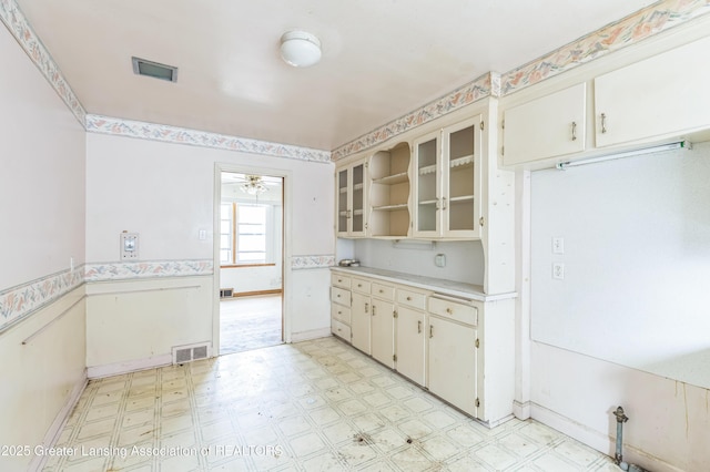 19326 Marlowe St, Detroit, MI 48235 - kitchen featuring light floors, light countertops, ceiling fan, glass insert cabinets, and open shelves