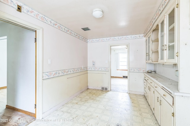 19326 Marlowe St, Detroit, MI 48235 - kitchen with light floors, light countertops, open shelves, and glass insert cabinets