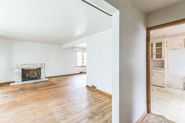 19326 Marlowe St, Detroit, MI 48235 - unfurnished living room featuring a high end fireplace and wood finished floors