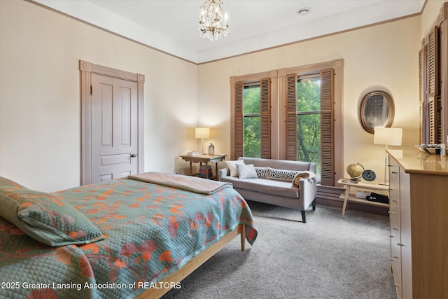 1035 N Capitol Ave, Lansing, MI 48906 - bedroom featuring carpet floors and a chandelier