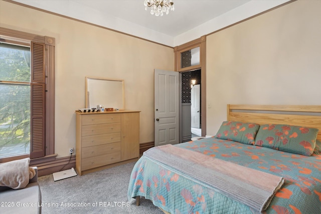 1035 N Capitol Ave, Lansing, MI 48906 - bedroom with carpet flooring and a chandelier
