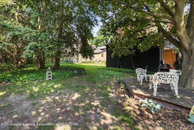 1035 N Capitol Ave, Lansing, MI 48906 - view of green lawn with a deck