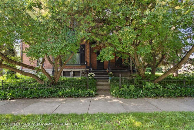 1035 N Capitol Ave, Lansing, MI 48906 - obstructed view of property with brick siding